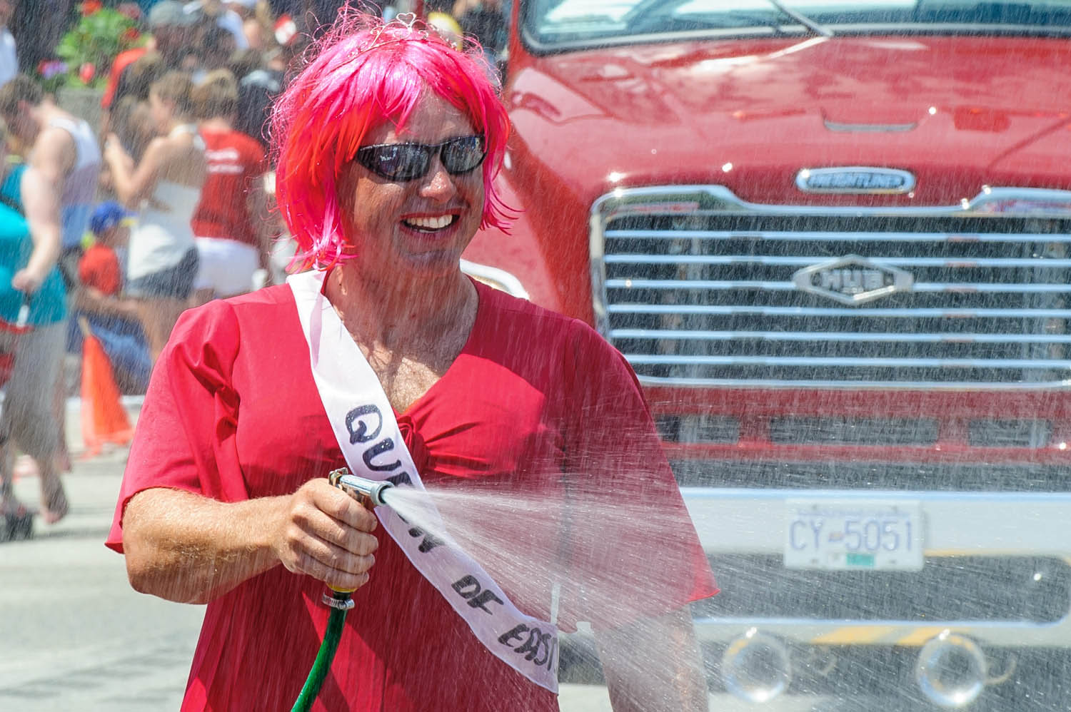 Osoyoos firefighter Chris Hanson sprays a hose in last year's water fight. (Richard McGuire file photo)