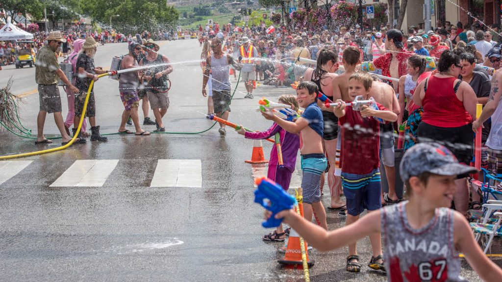 Children armed with plastic water guns took on the Osoyoos and Anarchist Mountain firefighters in an epic water fight before the Cherry Fiesta parade on July 1. (Richard McGuire photo)