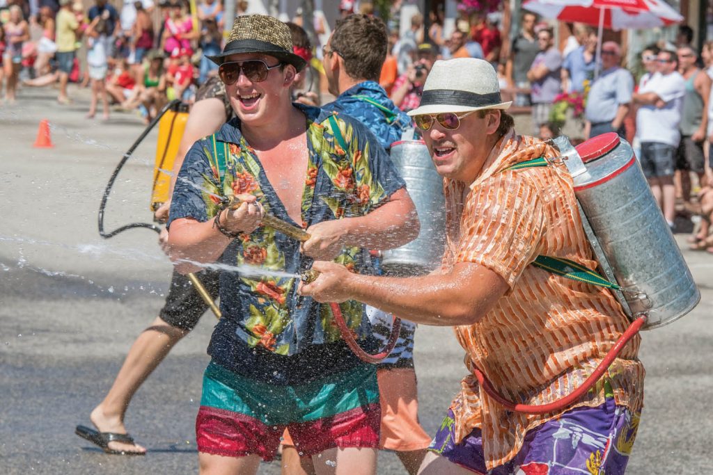 Osoyoos firefighters lead an opening attack on hordes of children armed with water guns. The water fight is a popular highlight of Cherry Fiesta and gets underway just before the parade. (Richard McGuire file photo)