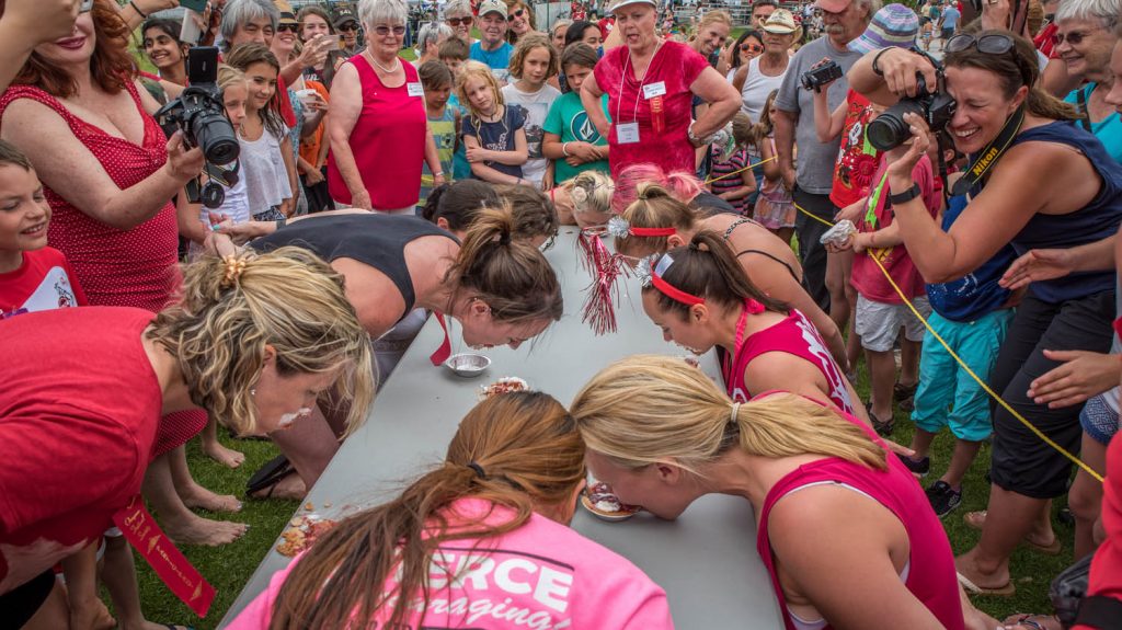 The women devoured cherry pies in seconds in the cherry pie eating contest at Cherry Fiesta on July 1. (Richard McGuire photo)