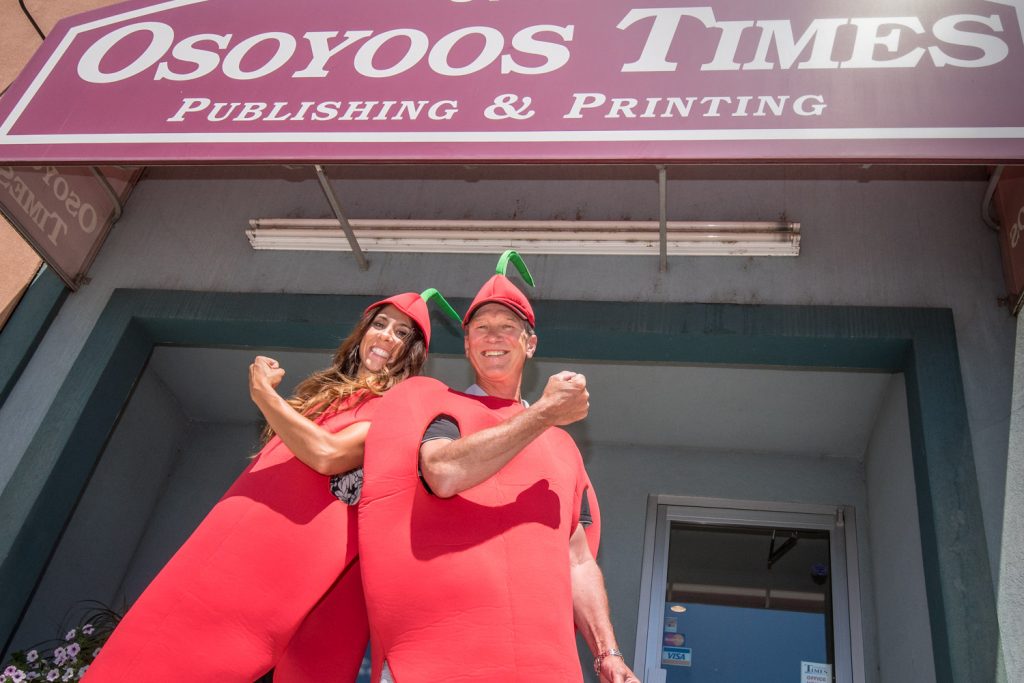 Ronda Jahn (left) and Ken Baker of the Osoyoos Times try out their new cherry costumes in anticipation of Cherry Fiesta. The two are regular participants in festival parades. (Richard McGuire photo)