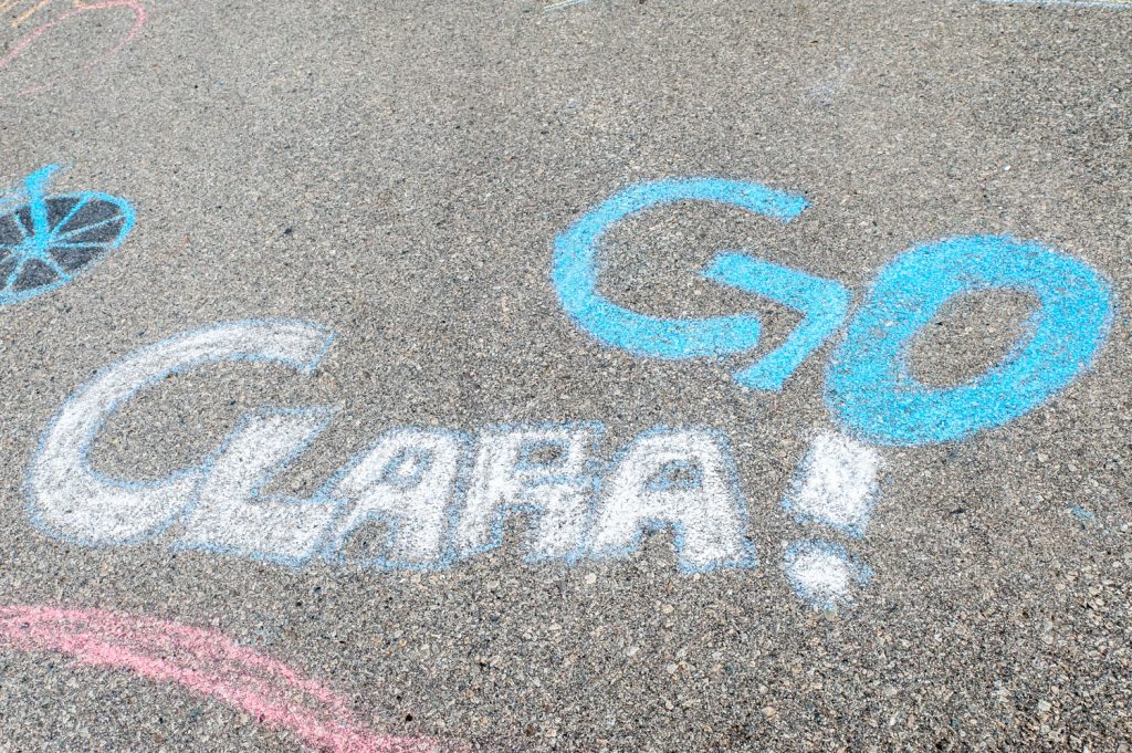 Students at Osoyoos Secondary School wrote words of encouragement in chalk on the walkway outside the theatre to encourage Clara Hughes as she headed out on her bicycle trip up Anarchist Mountain. (Richard McGuire photo)
