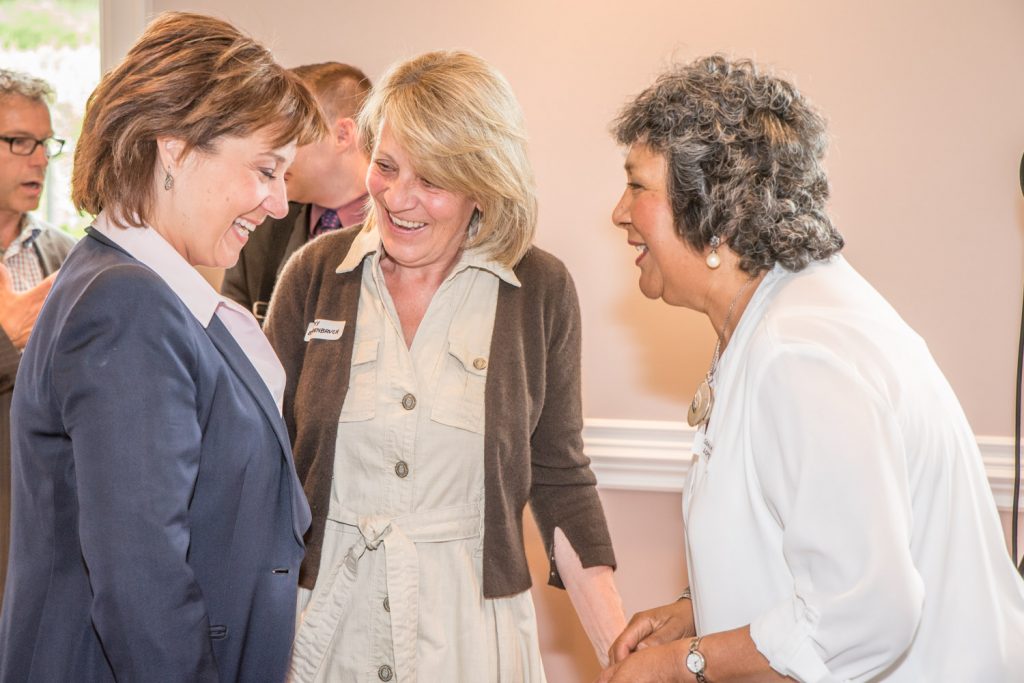 Premier Christy Clark (left) shares a laugh with Cathy Behrenbruch and Sonia Lopez, both from Osoyoos. The premier spoke at a lunch event organized by the South Okanagan Chamber of Commerce at Silver Sage Winery last Thursday. (Richard McGuire photo)