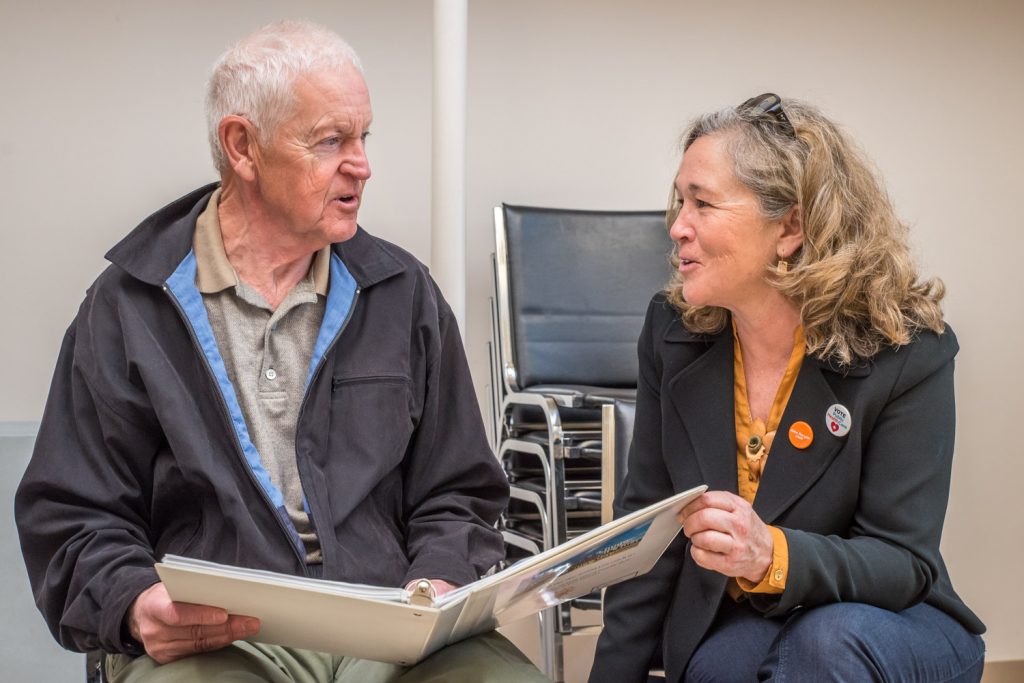 Paul McCavour, an Osoyoos advocate for solar energy, spoke with NDP candidate Colleen Ross last Tuesday at a meet and greet at the Sonora Community Centre. Ross was just one of six B.C. candidates from all parties to be endorsed by GreenPAC, a non-partisan environmental political action group. (Richard McGuire photo)