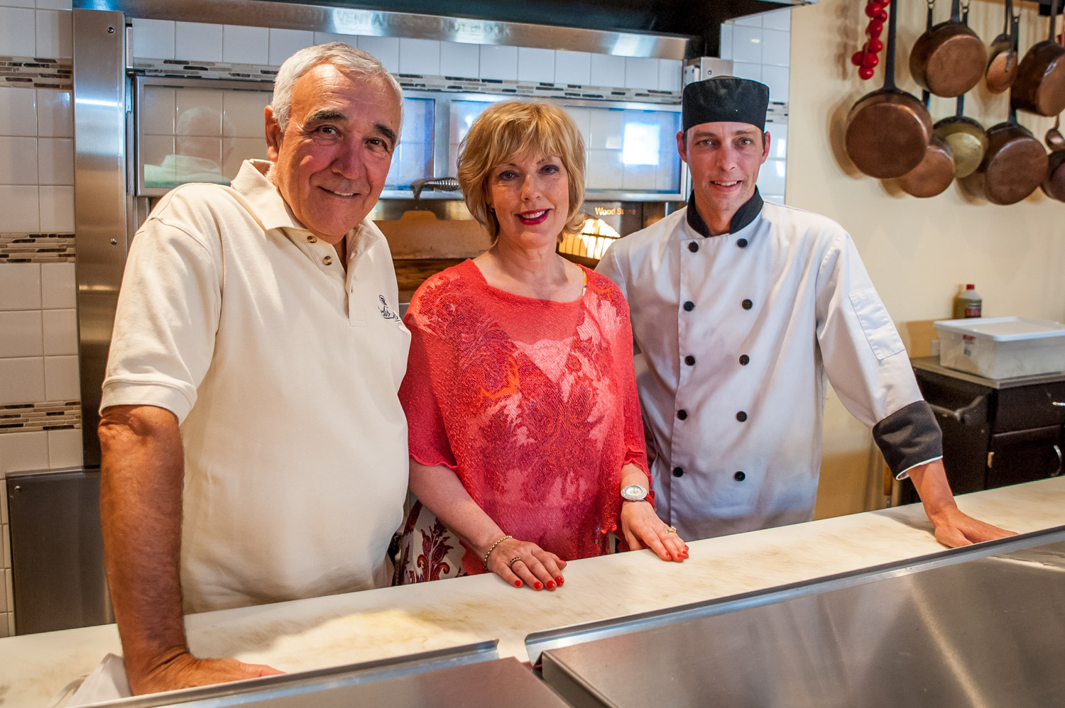 Charles Perrutel and his wife Johane Dupont are the proud owners of the new Convivia Restaurant in downtown Osoyoos. The couple, along with head chef Mathieu Vallieres (far right) worked together for many years at a restaurant in Quebec. Vallieres will be taking over Convivia when Perrutel and Dupont retire sometime in the next few years. The owners and chef are very pleased with the response to their European-style bistro since it opened in late May. (Richard McGuire photo)