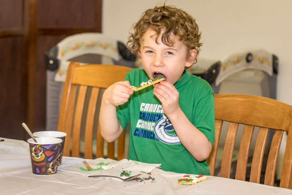 Chase Salmond, 6, of Osoyoos was very busy decorating cookies at Troy's Grill on Saturday afternoon. It was hard work. Of course a major part of the decorating process involves frequent tasting, just to make sure everything is right. Troy’s Grill was just one of a number of businesses running their own events during Christmas Lite-Up.  (Richard McGuire photo)