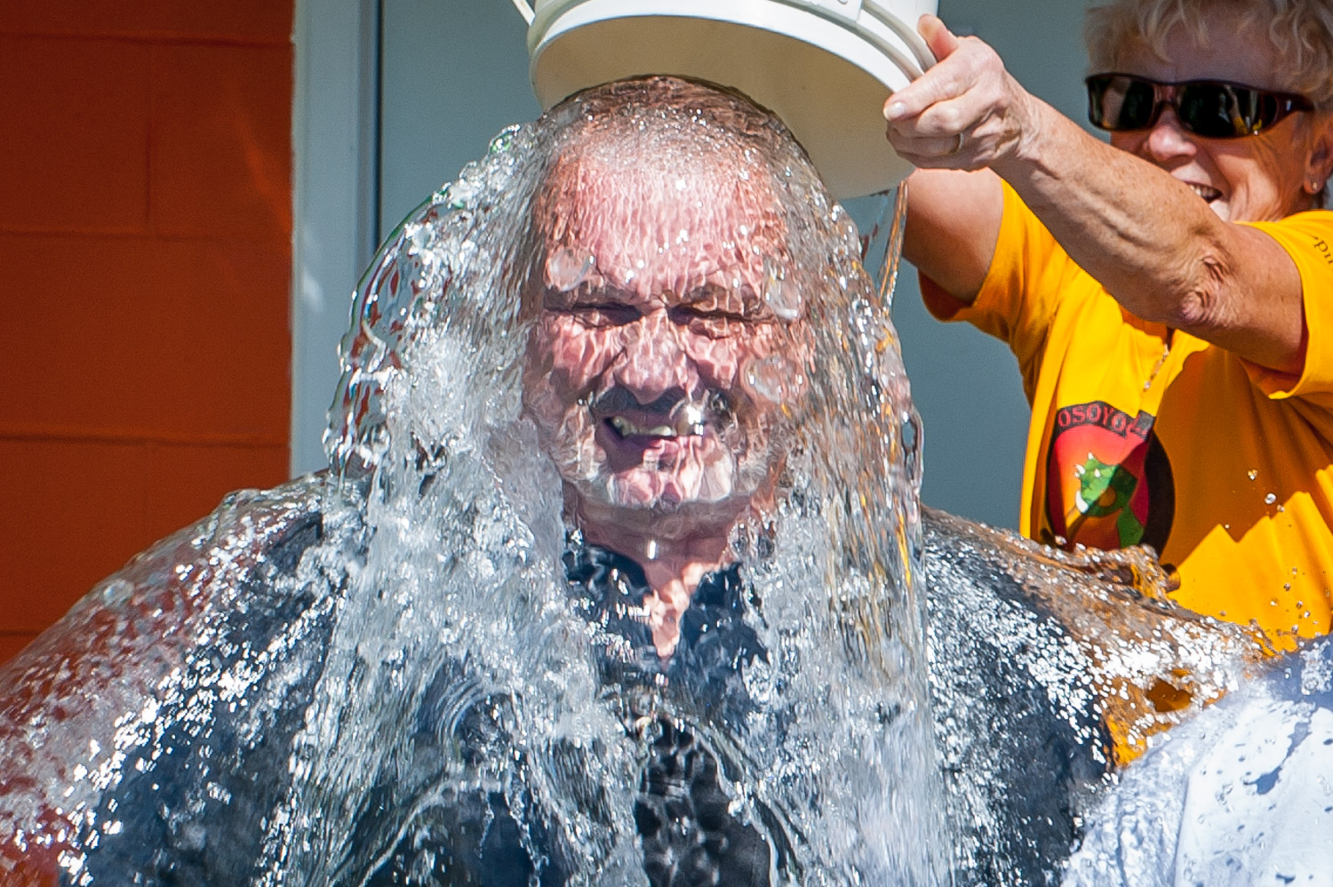 Osoyoos Councillor CJ Rhodes endures a bucket of ice water courtesy of the Osoyoos Lake Paddling Club dragon boat team. The dragon boaters challenged council to the ALS Ice Bucket Challenge. All council members took part except for Michael Ryan who had another engagement. (Richard McGuire Photo)