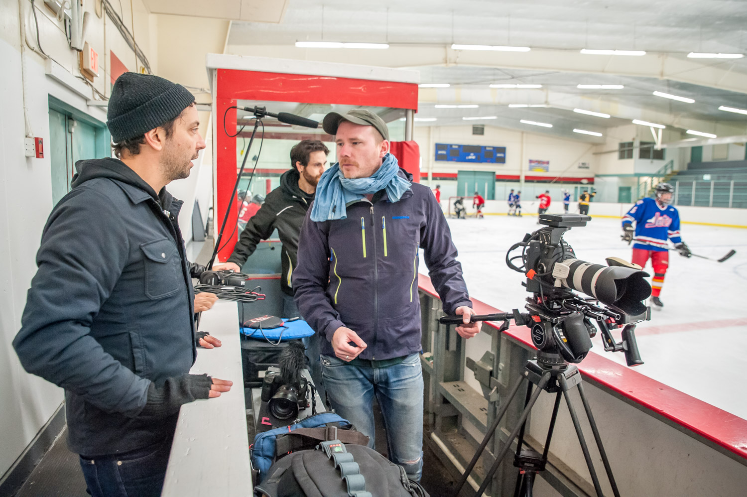 The video crew discusses their next shots while Harold Cox gets into the play, scoring a goal. (Richard McGuire photo)