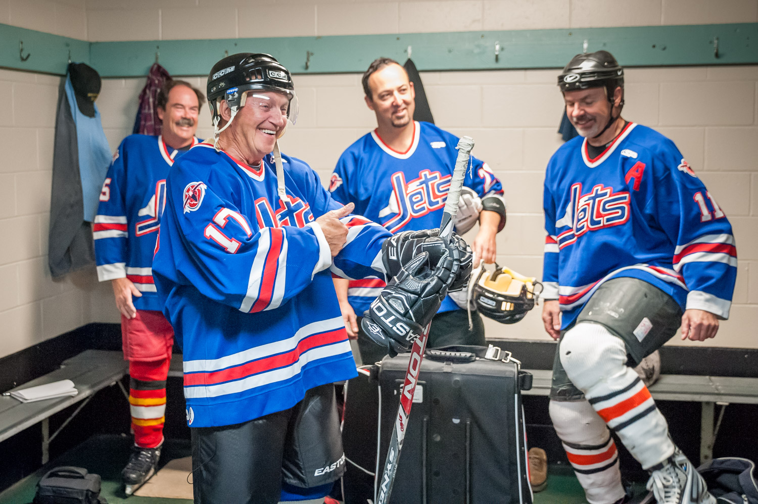 Harold Cox (second from left) meets his teammates in the dressing room. (Richard McGuire photo)