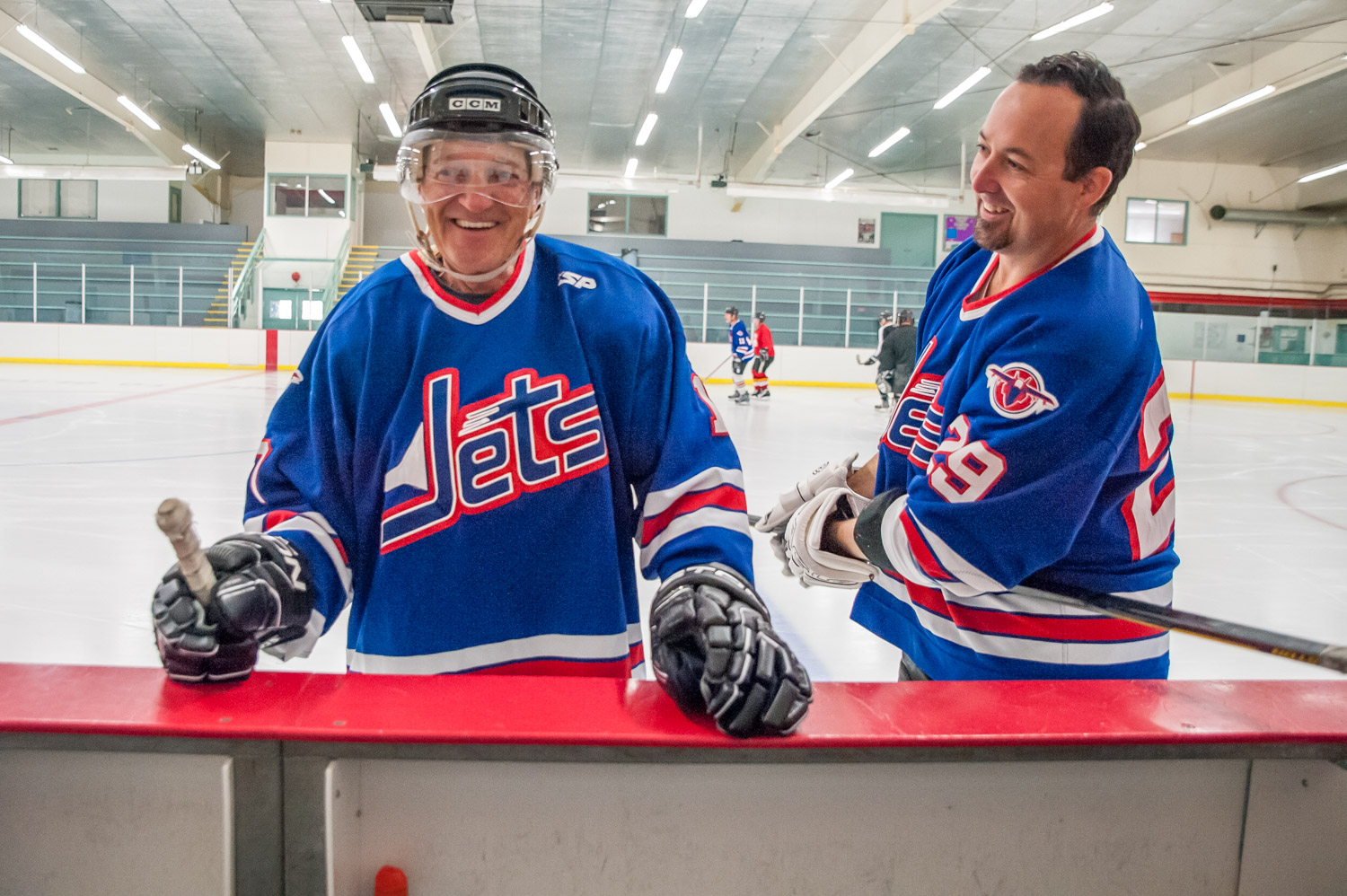 Harold Cox savours his first moments on the ice, getting some encouragement from Jeff Crowley. (Richard McGuire photo)