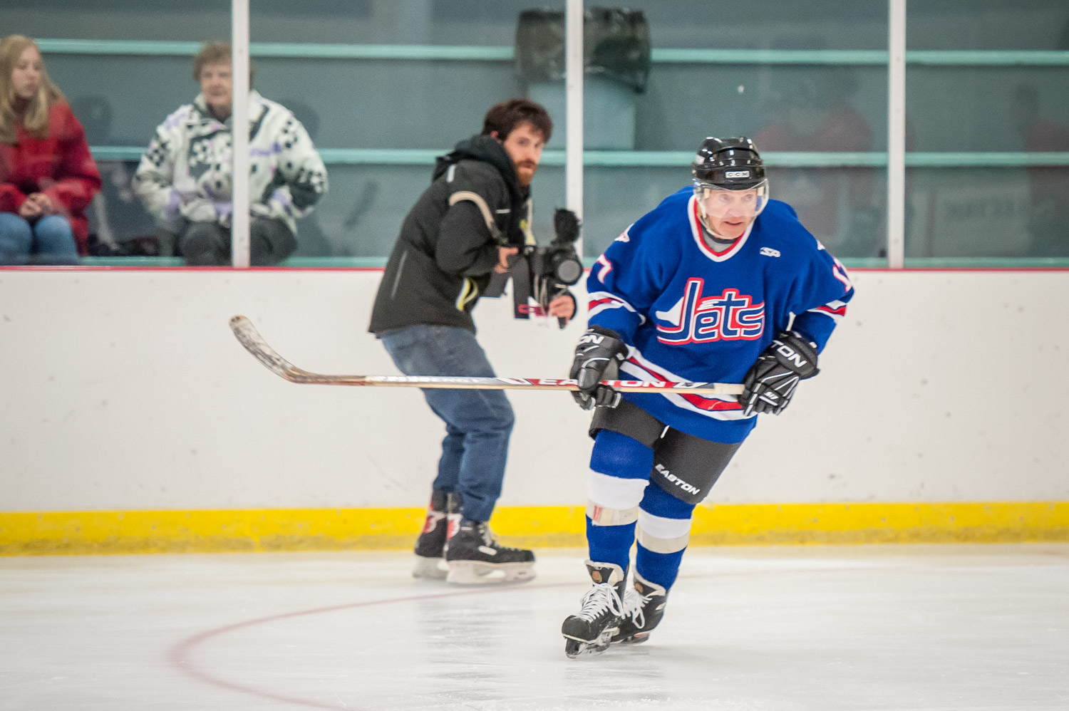 Harold Cox gets into the play while being followed by a camera man on skates. (Richard McGuire photo)