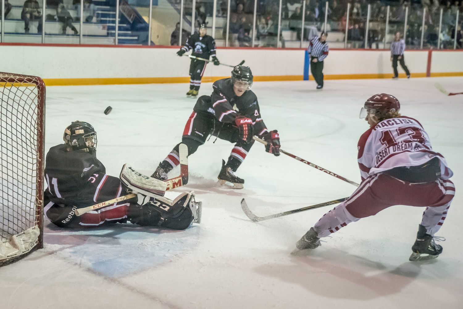 Troy Maclise flips the puck into the net in the first of two apparent goals that were disallowed. This one was in the first period of Saturday's game against the Summerland Steam. Maclise had a good game anyway, scoring the winning goal, assisting on the second Coyote goal and being chosen first star of the game. (Richard McGuire photo)