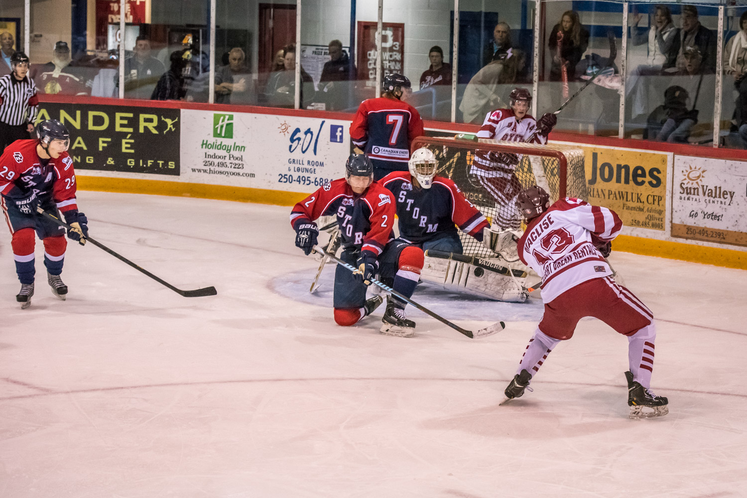 Troy Maclise (right) managed to get the puck when Kamloops goalie Jason Sandhu was caught out of position. A second later Maclise scored the Coyotes' second goal in their 4-3 victory over Kamloops on Friday evening. (Richard McGuire photo)
