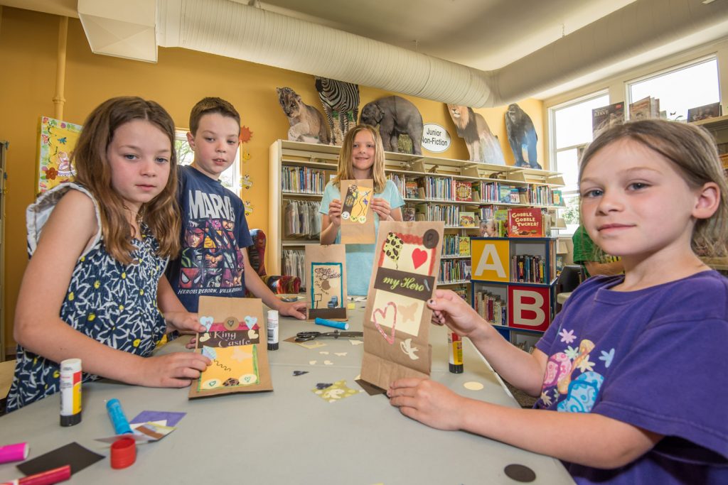 Children were making Father's Day cards at the Osoyoos Library last Wednesday for Crafternoon. The session for children eight to 12 was conducted by Shannon Lavender. From left are Emily Fichter, 8, Karl Fichter, 11, Kaitlyn Rempel, 11 and Gyll Burton, 8. (Richard McGuire photo)