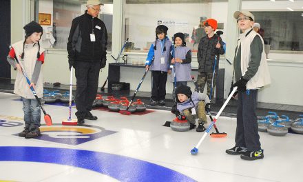 Learning to curl – with a broom, and a smile!