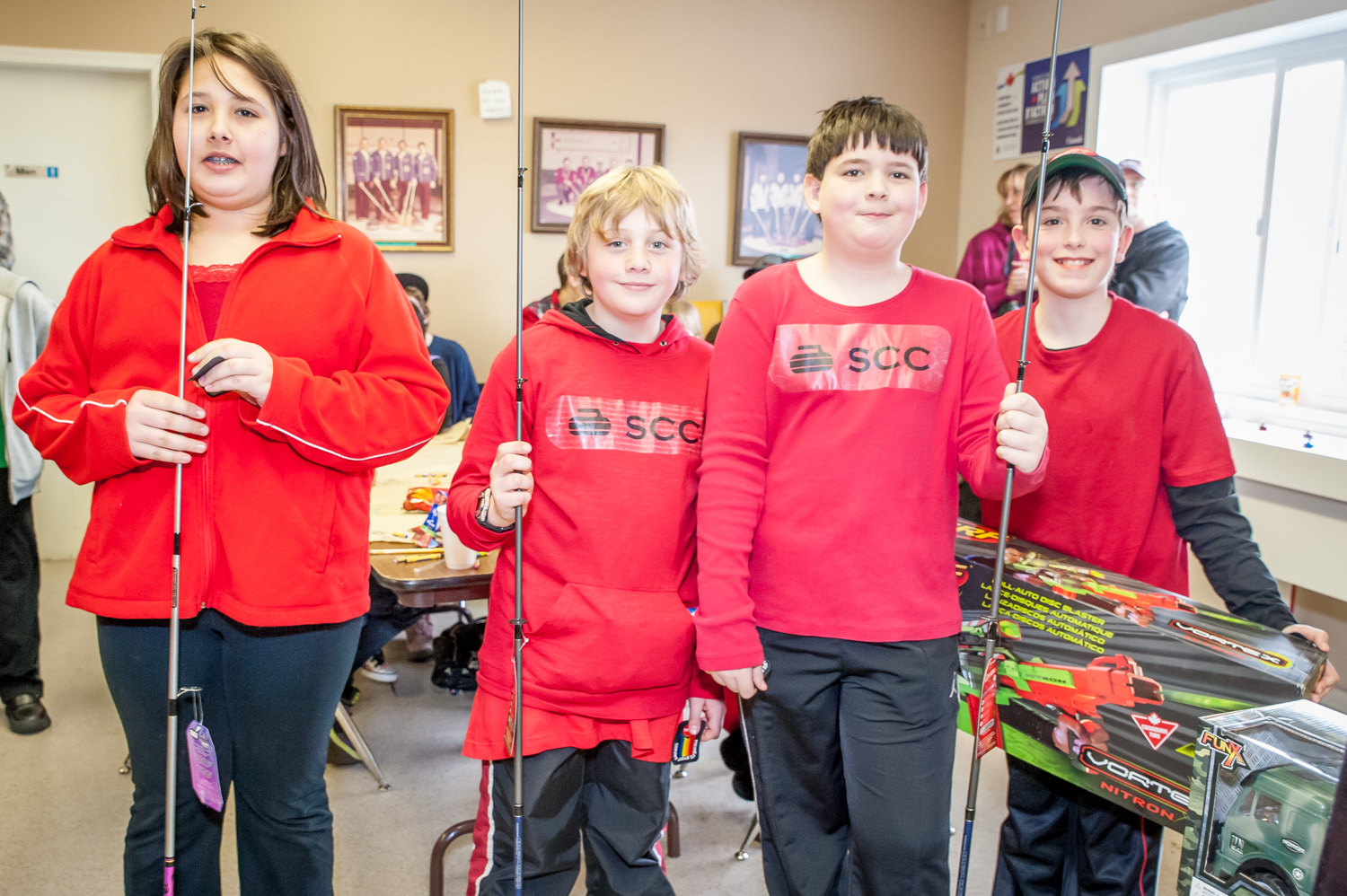 These youngsters from the Summerland 1 curling team finished in first place at the Elks Junior Bonspiel Saturday. Second and third places were also taken by out-of-town teams, both from Grand Forks. Winning teams got their picks of prizes and the fishing rods were the first items to go. From left are Hayley Kruger, Jacob Martin, Kaeden Seiter and Reilly Noble. (Richard McGuire photo)