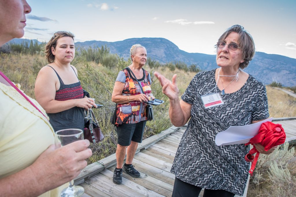 Guide Lee McFadyen, president of the Osoyoos Desert Society, talks to guests about how snakes smell their prey with their tongues as she leads guests around the boardwalk. (Richard McGuire photo)
