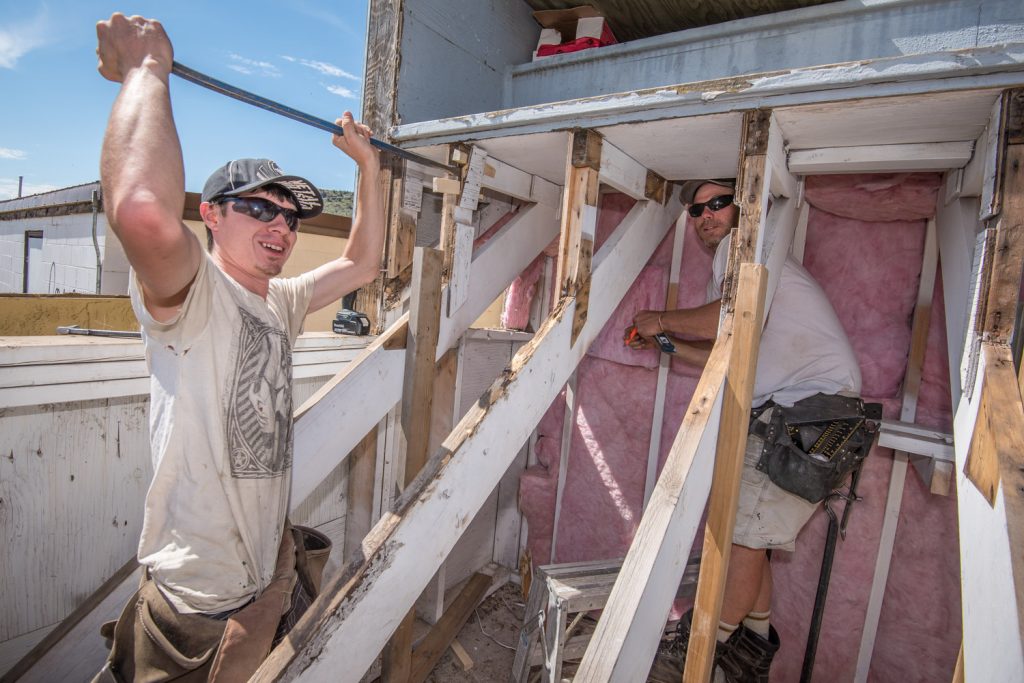 Craig Piper (left) and Gordie Reedman were busy last week removing rotten wood from the old bleachers at Desert Park. They and their fellow workers managed to save a nest of birds discovered during the work. (Richard McGuire photo)