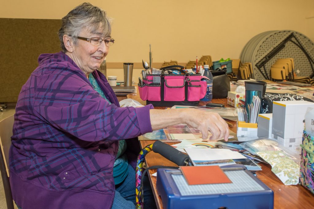 Laurel Turner, of Osoyoos, worked on making greeting cards at the Osoyoos Baptist Church on Saturday. Participants rented tables to do their work as a fundraiser for Desert Sun Counselling's Men's Counselling Program. (Richard McGuire photo)
