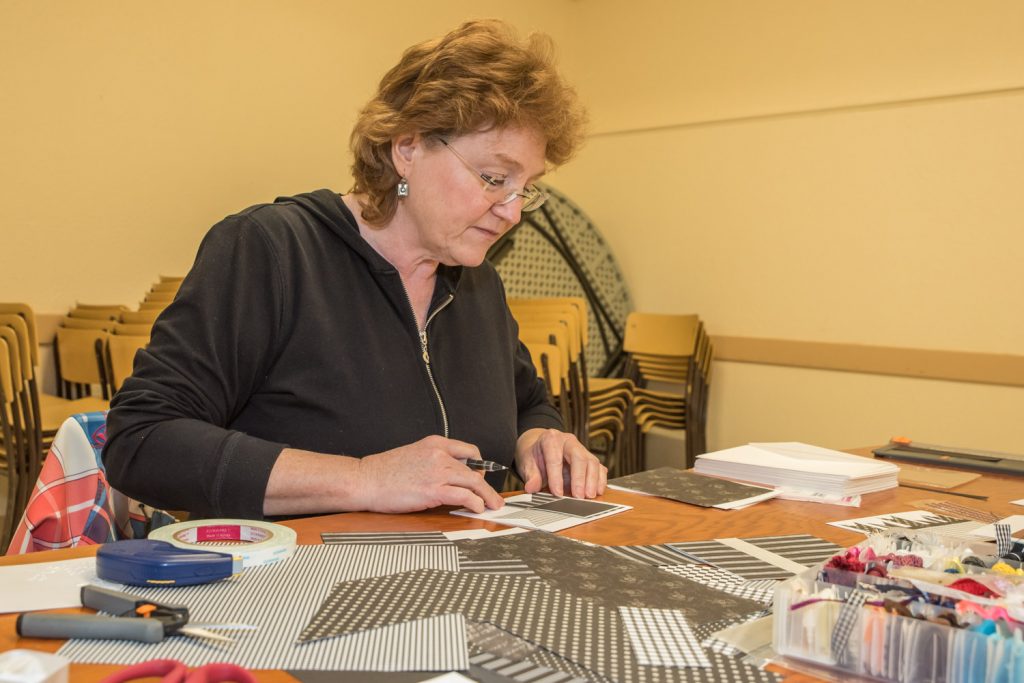 Laurel Turner, of Osoyoos, worked on making greeting cards at the Osoyoos Baptist Church on Saturday. Participants rented tables to do their work as a fundraiser for Desert Sun Counselling's Men's Counselling Program. (Richard McGuire photo)