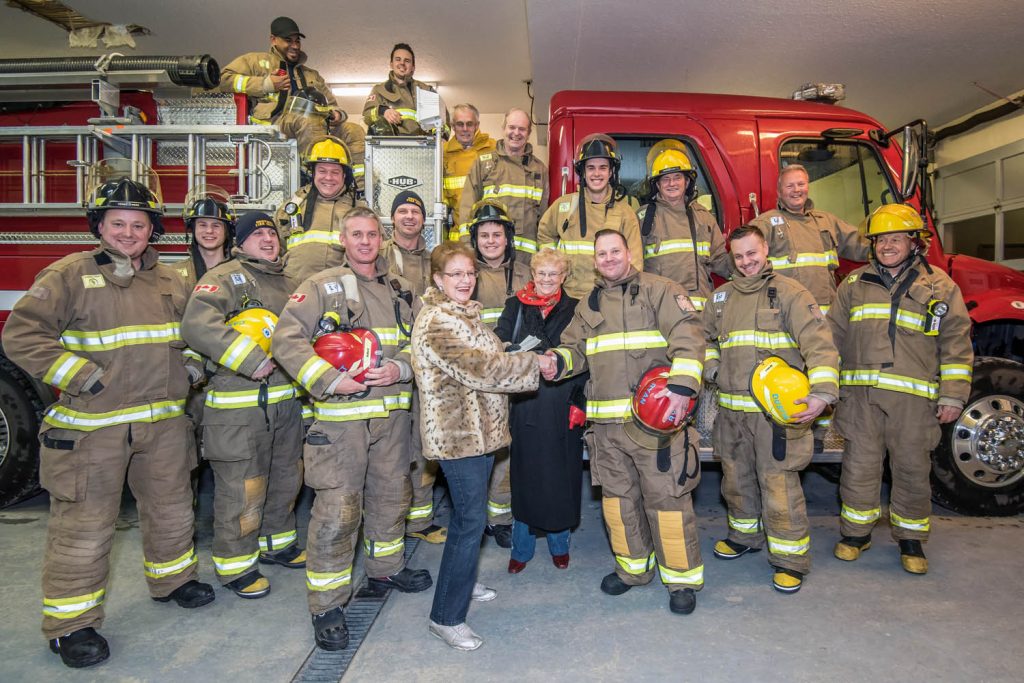 The Dorcas Ladies of the United Church handed over cheques to the Osoyoos Fire Department last week with funds raised at the Osoyoos United Church Thrift Shop. In centre making the presentation were Marie Therrien, president, and Anne Poiischuk, vice-president. Receiving the cheques was Ryan McCaskill, lieutenant. The ladies contributed $2,000 for training and equipment and $500 for the Blake Sewell fund. (Richard McGuire photo)
