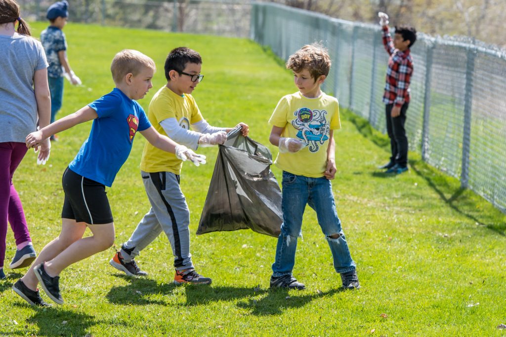 Osoyoos Elementary School students celebrated Earth Day on Friday by fanning out around Osoyoos and cleaning up litter. Julie Dias' grades 2-3 class, pictured here, was assigned to clean up the school yard. (Richard McGuire photo)