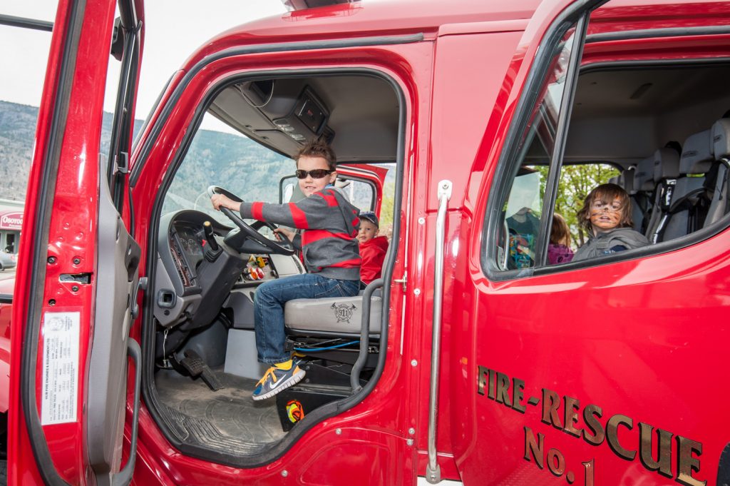 Children eagerly took turns getting into the driver's seat of one of the fire engines at the Osoyoos Fire Hall Saturday. Local firefighters had a strong presence during several events at Easter Eggstravaganza. Taydem Wilson of Pitt Meadows takes his turn. (Richard McGuire photo)