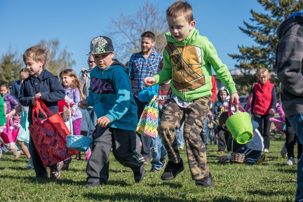 No sooner did Mayor Sue McKortoff utter the word "go" when swarms of children raced out onto the field with Easter baskets in their hands. The Easter egg hunt is always one of the highlights of Easter Eggstravaganza. Children scooped up all the eggs in seconds, some assisted by their parents. (Richard McGuire photo)