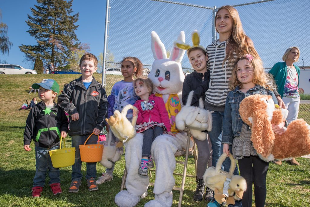 Many children and families posed for pictures with two Easter Bunnies after the egg hunt. The bunnies were Ronda Jahn and Ken Baker of the Osoyoos Times. (Richard McGuire photo)