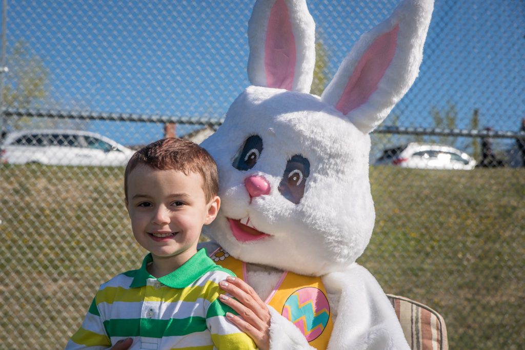Many children and families posed for pictures with two Easter Bunnies after the egg hunt. The bunnies were Ronda Jahn and Ken Baker of the Osoyoos Times. (Richard McGuire photo)