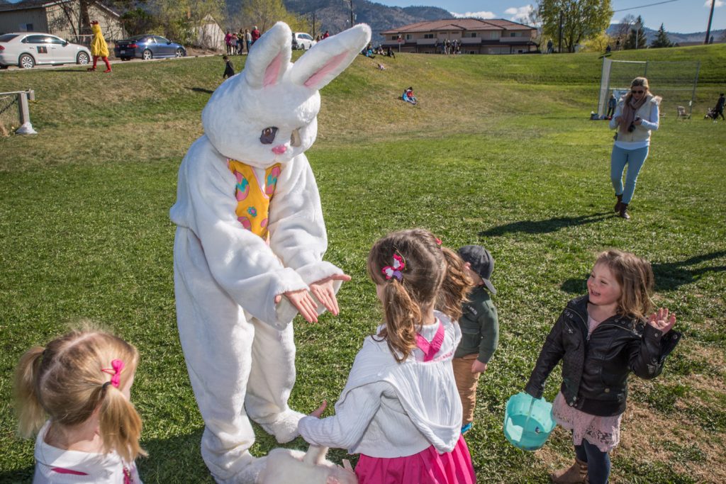 Children chased after the Easter Bunny to give high fives and hugs. This bunny was Ronda Jahn of the Osoyoos Times. (Richard McGuire photo)