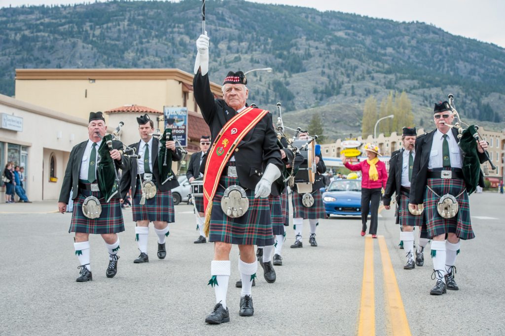 Members of Summerland Pipes and Drums march down Main Street during Saturday's Easter parade. (Richard McGuire photo)
