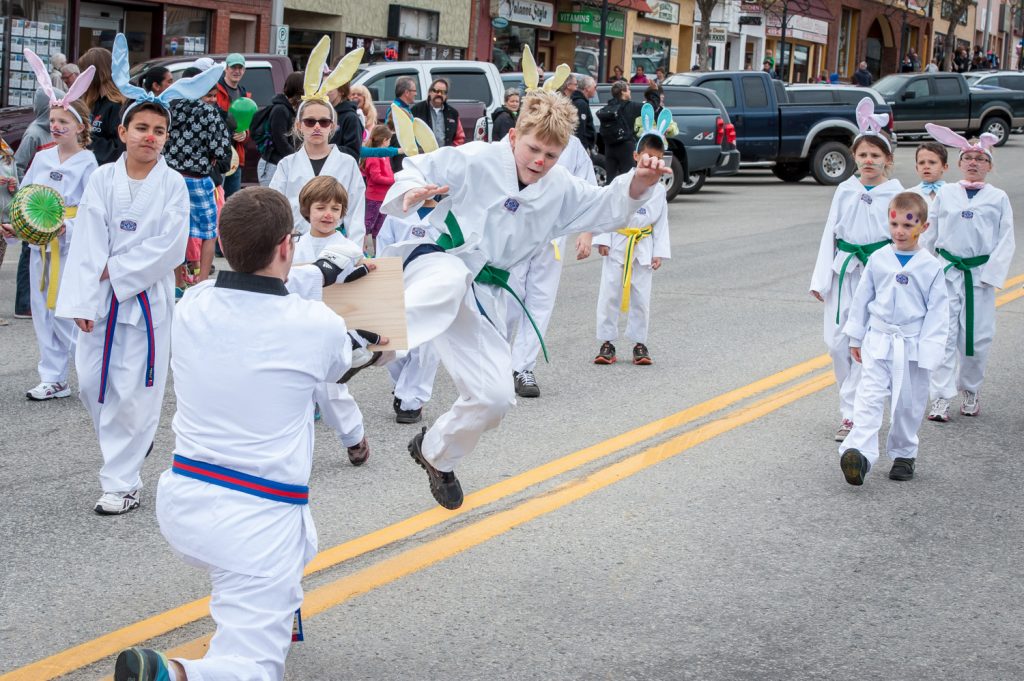 Students from Outlast Tae Kwon Do gave board breaking demonstrations as they paraded down Main Street wearing bunny ears. (Richard McGuire photo)