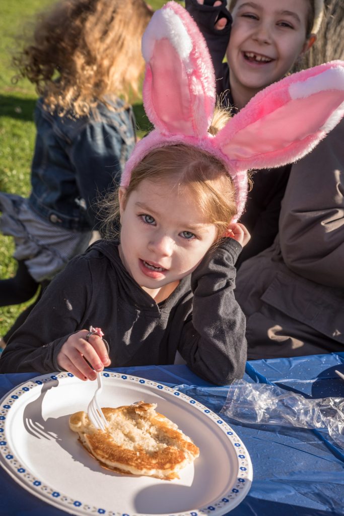 Arianna Hamel, of Langley, was all ears as she ate her pancake breakfast at Easter Eggstravaganza on Saturday. (Richard McGuire photo)