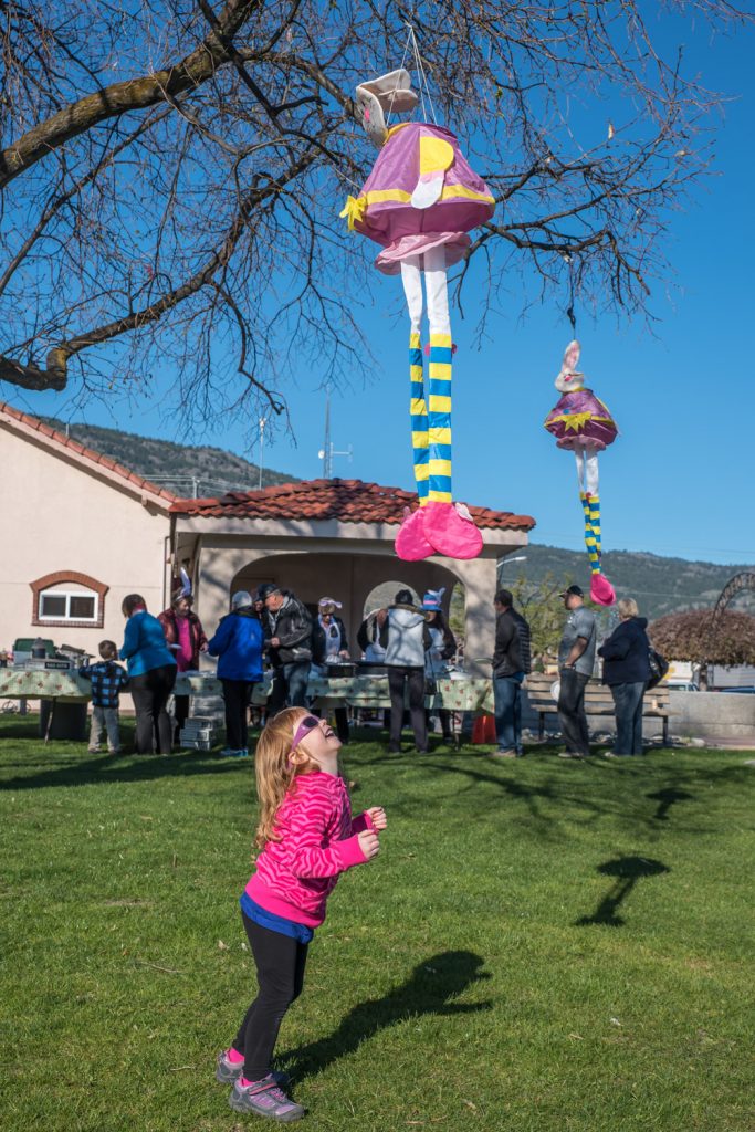 Children had fun jumping for Easter Bunnies hanging from trees at town centre. (Richard McGuire photo)