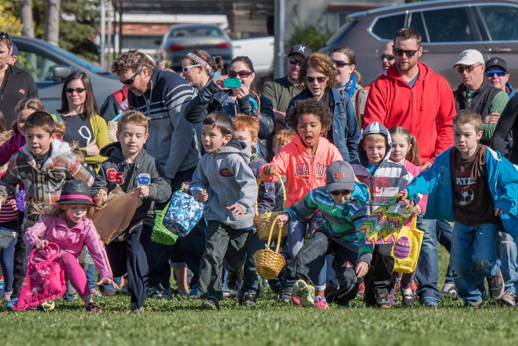 No sooner did Mayor Sue McKortoff utter the word "go" when swarms of children raced out onto the field with Easter baskets in their hands. The Easter egg hunt is always one of the highlights of Easter Eggstravaganza. Children scooped up all the eggs in seconds, some assisted by their parents. (Richard McGuire photo)