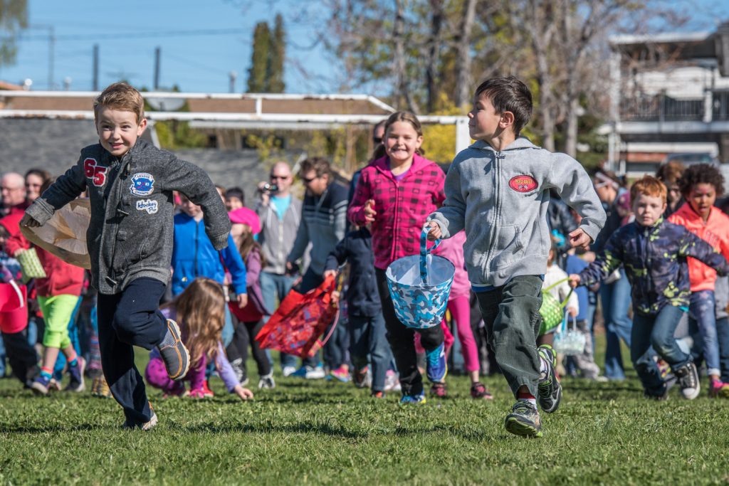 No sooner did Mayor Sue McKortoff utter the word "go" when swarms of children raced out onto the field with Easter baskets in their hands. The Easter egg hunt is always one of the highlights of Easter Eggstravaganza. Children scooped up all the eggs in seconds, some assisted by their parents. (Richard McGuire photo)