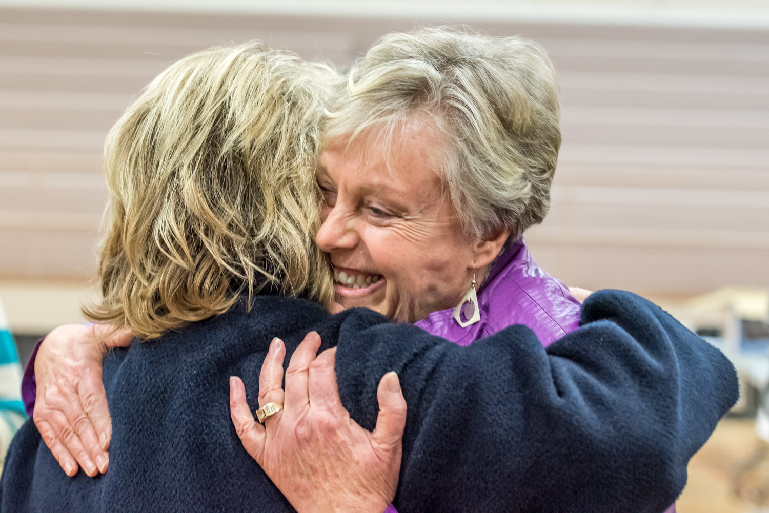 Carol Youngberg (left) and Sue McKortoff congratulate each other after results are announced. McKortoff won as mayor by a landslide. Youngberg tied incumbent C.J. Rhodes at 1,199 votes in the top spot among the new councillors. (Richard McGuire photo)