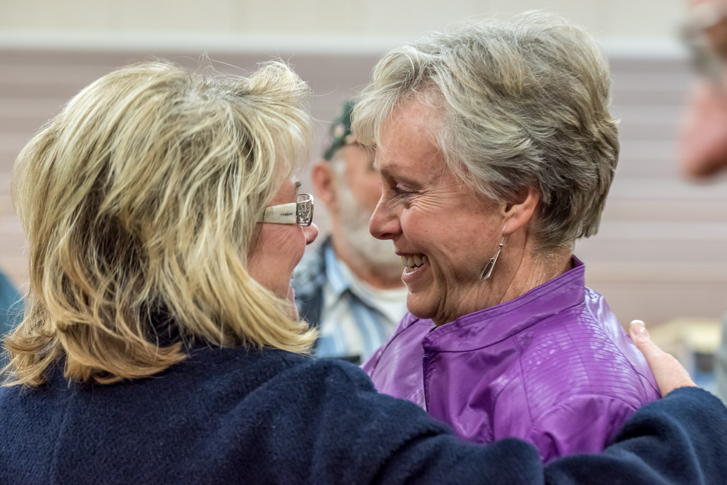 Carol Youngberg (left) and Sue McKortoff congratulate each other after results are announced. McKortoff won as mayor by a landslide. Youngberg tied incumbent C.J. Rhodes at 1,199 votes in the top spot among the new councillors. (Richard McGuire photo)