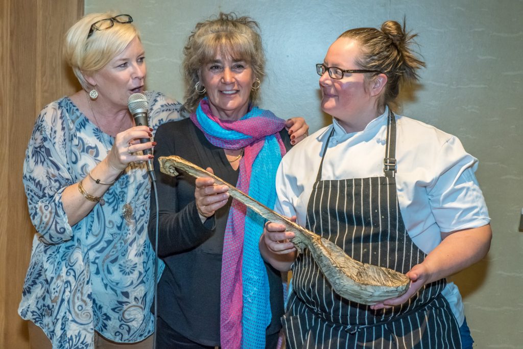 Sandy Summers (left), who organized the empty bowl event, congratulates chef Natasha Schooten who won the people's choice award and ceremonial ladel. In the centre is Pat Batchelor, chair of Desert Sun's board. Schooten is chef at Mica at Spirit Ridge and her winning entry was Mulligatawny soup with Harker's Organics honeycrisp apples and snow apple cider. (Richard McGuire photo)