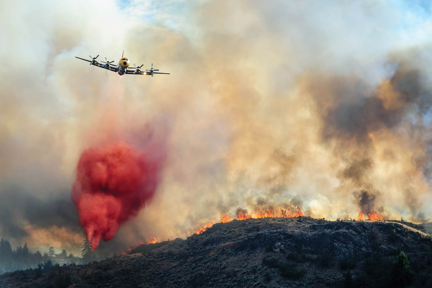 Reporter/Photographer Richard McGuire was awarded gold in the spot news photo category among papers in the 25,000 and under class for this photo of a tanker plane dropping retardant on an Aug. 19, 2013 wildfire at Spotted Lake. The Ma Murray awards were presented by the British Columbia and Yukon Community Newspapers Association (BCYCNA) on Saturday, April 26 in Richmond, B.C. (Richard McGuire photo)