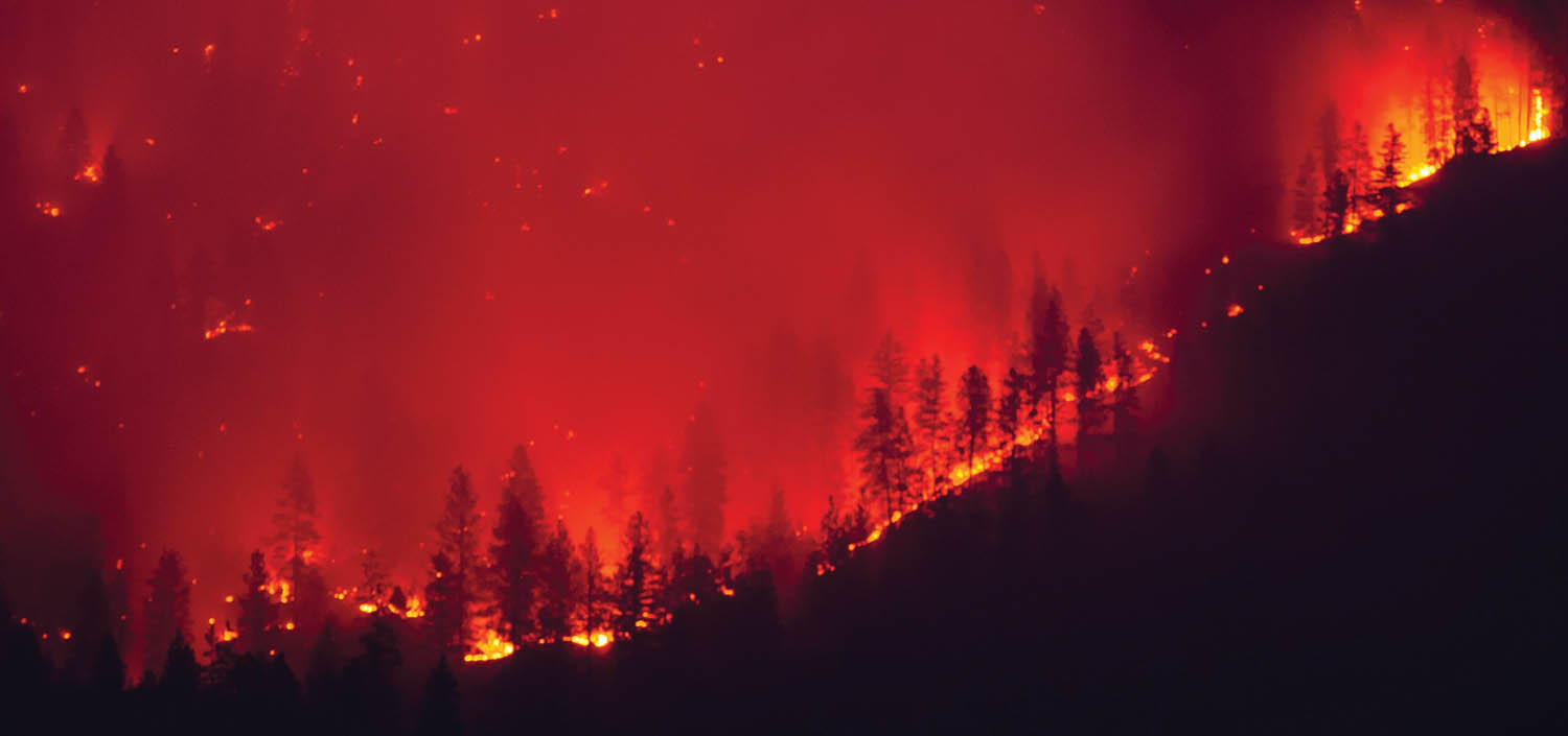 Fire burns on the mountain east of Osoyoos Lake sending up smoke. (Richard McGuire photo)