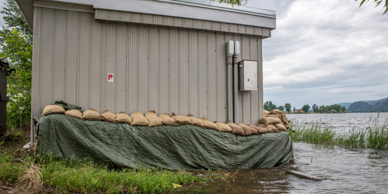 Town cleans up debris as lake levels slowly return to normal; residents reminded to leave sandbags in place