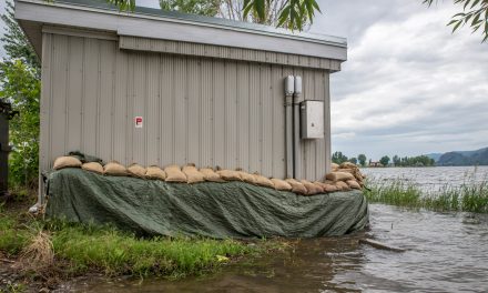 Town cleans up debris as lake levels slowly return to normal; residents reminded to leave sandbags in place