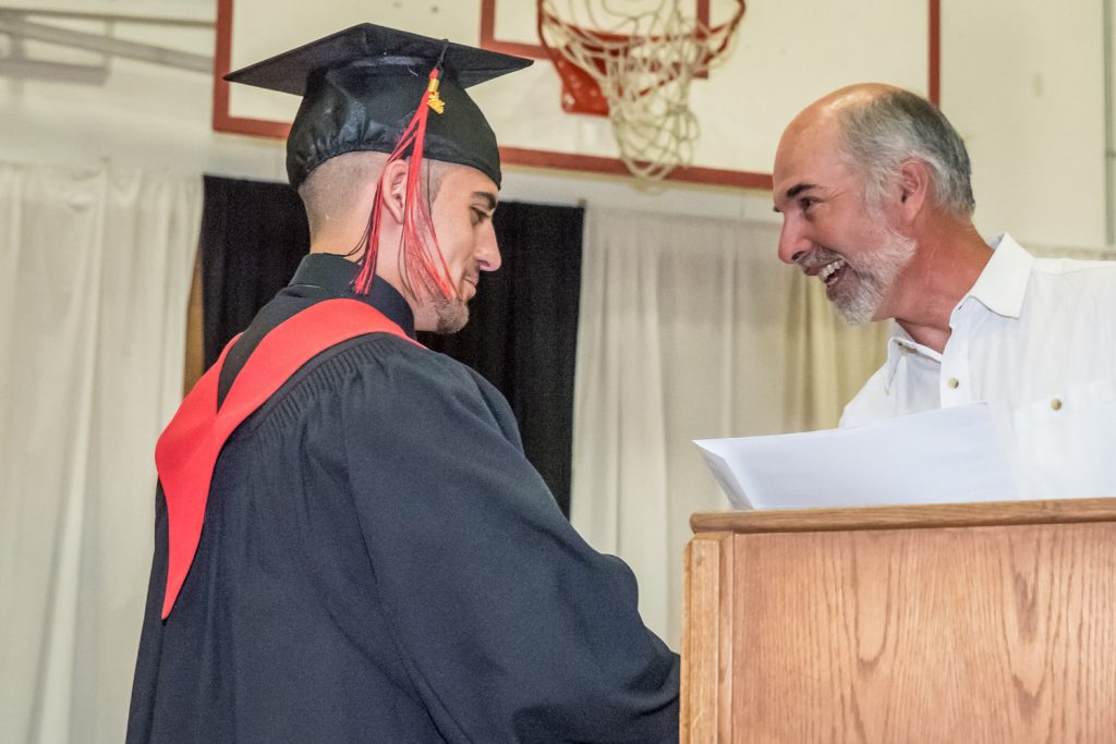 Teacher Ivor Langley presents the Secondary School Apprenticeship Scholarship to Nicholas Silva. (Richard McGuire photo)