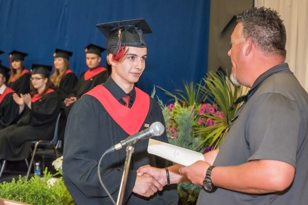 Len McLean of McLean Construction presents Robby Rosa with a McLean Construction scholarship. McLean was up four times to present awards on behalf of his company. (Richard McGuire photo)
