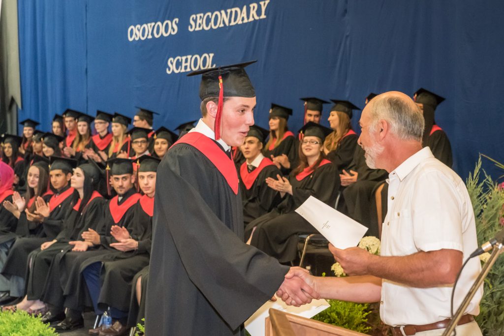 Teacher Ivor Langley presents the Secondary School Apprenticeship Scholarship to Connor Hass. (Richard McGuire photo)
