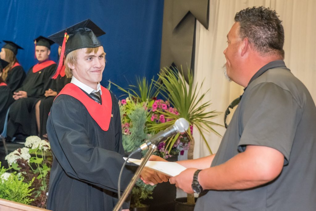 Len McLean of McLean Construction presents Cameron Helm with a McLean Construction scholarship. McLean was up four times to present awards on behalf of his company. (Richard McGuire photo)