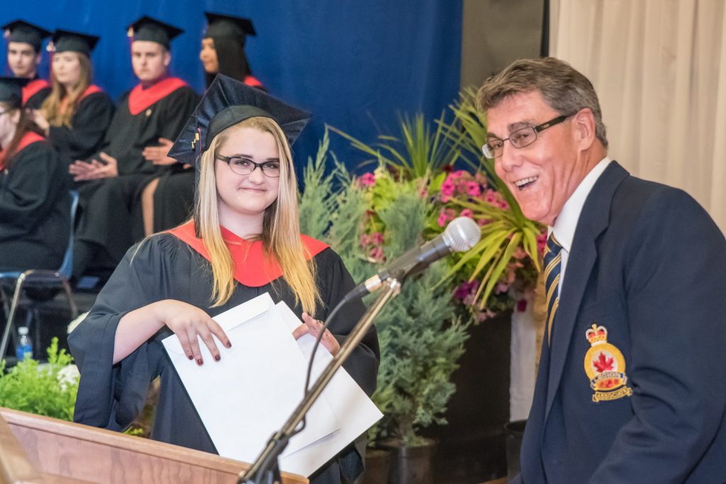 Garry Sutton, representing the Royal Canadian Legion Branch 173, presents an award on behalf of the Legion to Viveka Jensen. (Richard McGuire photo)