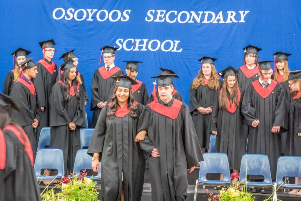 Graduates leave the stage at the end of the ceremony. (Richard McGuire photo)